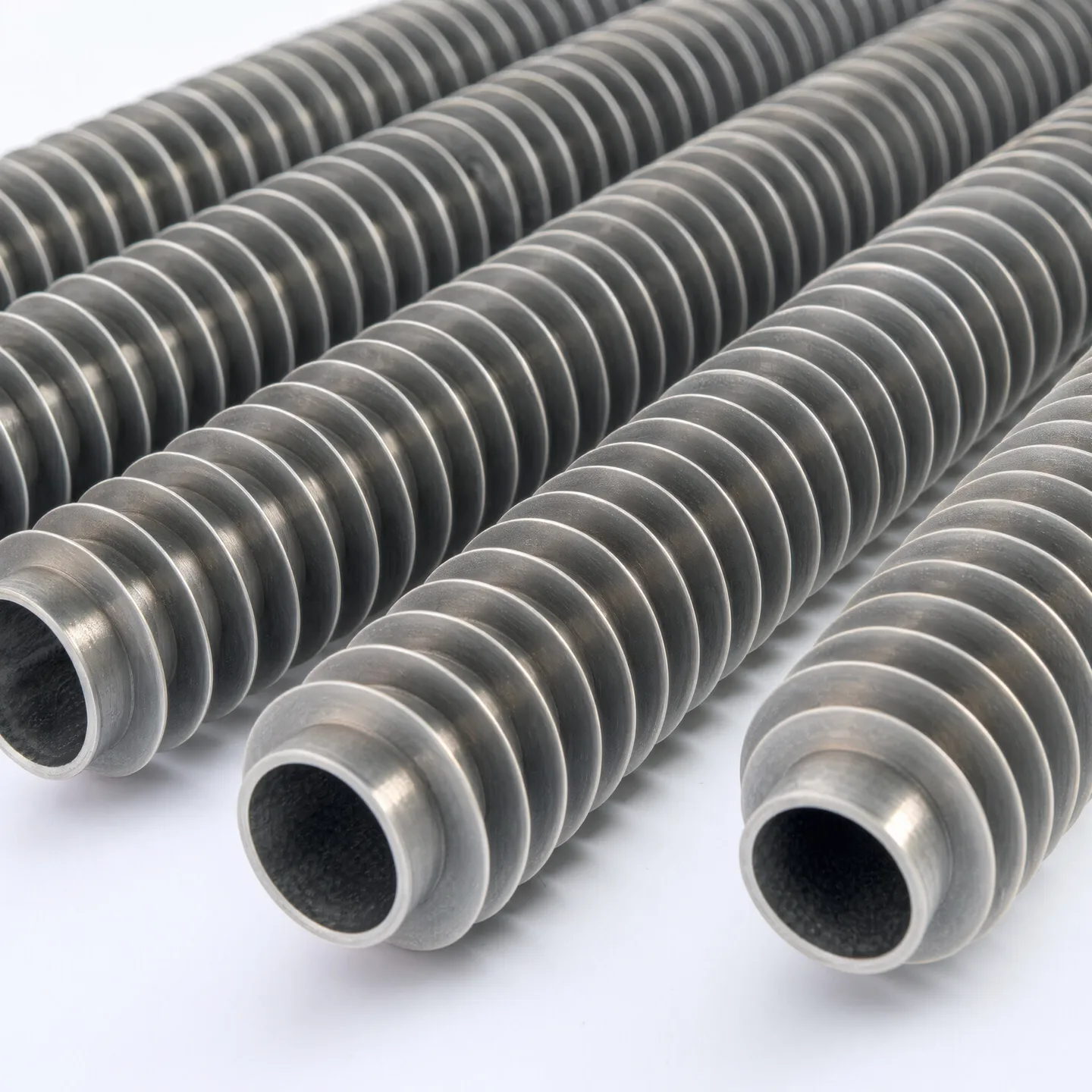 Macro view of continuous fins on parallel heat exchanger tubes
